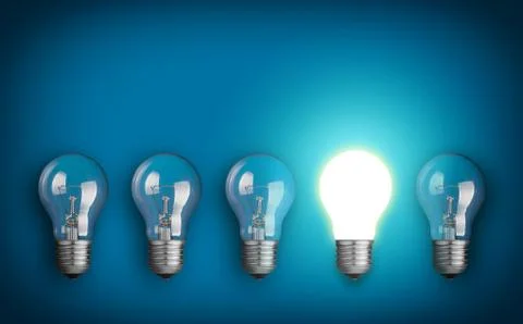Idea concept with row of light bulbs and glowing bulb Stock Photos