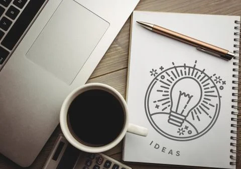 Idea doodle on notepad with pen next to laptop and coffee Stock Photos