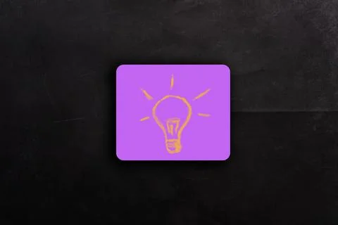Idea in the form of a light bulb on pink note paper Stock Photos