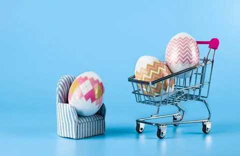 The idea of home delivery of purchases for Easter, on a blue background Stock Photos