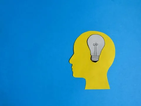 Idea Inside the Head on Blue Background Stock Photos