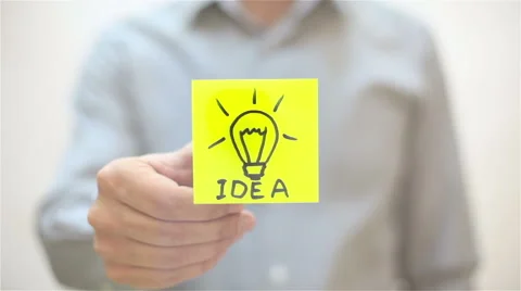 Idea. A man sticks a note on transparent screen Stock Footage 67830111