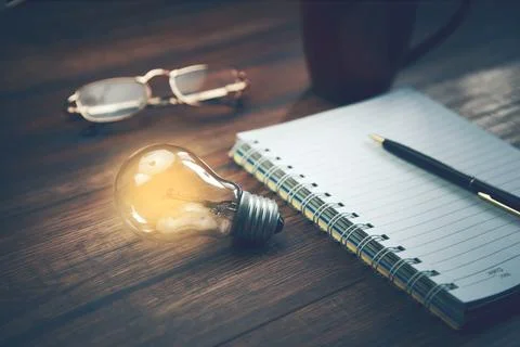 Idea with notepad on table Stock Photos