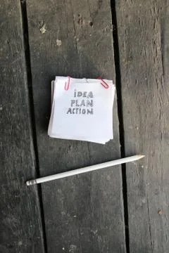 Idea plan action concept, inscription on a white sheet of paper Stock Photos