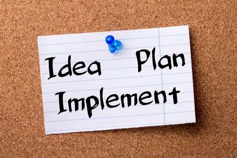 Idea - Plan - Implement - teared note paper pinned on bulletin board Foto stock