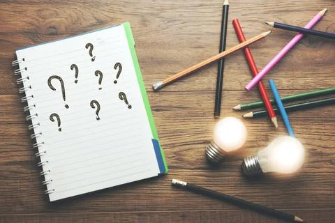 Idea with question mark on the notebook with pencils Stock Photos