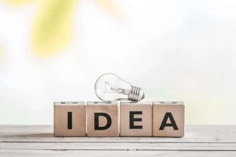 Idea sign with a light bulb Stock Photos