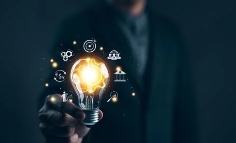 Idea solution business strategy concept. Businessman hand holding light bul.. Stock Photos