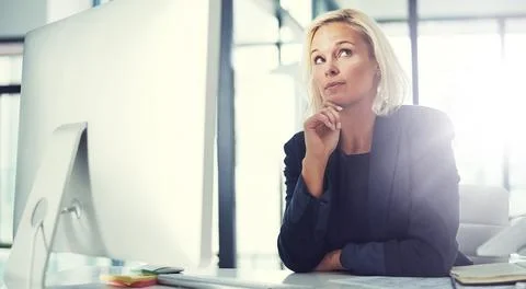 Idea, thinking and computer with business woman in office for vision, credit Stock Photos