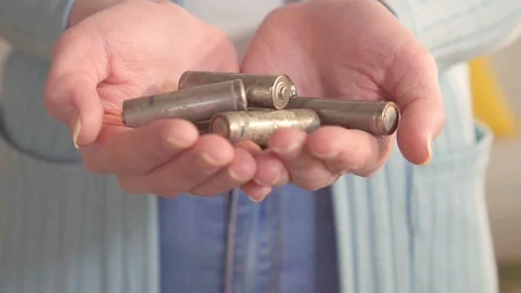 Idea used AA batteries on hands Stock Footage 106363366