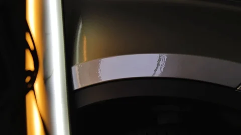 The ideal surface of the car after a collision, PDR technology, close up under Stock Footage 113110760