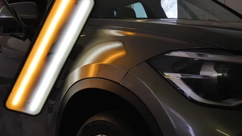 The ideal surface of the car after a collision, PDR technology, close up under Stock Footage 113110821