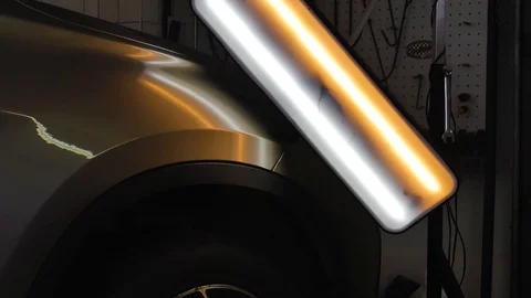 The ideal surface of the car after a collision, PDR technology, close up under Stock Footage 113110864