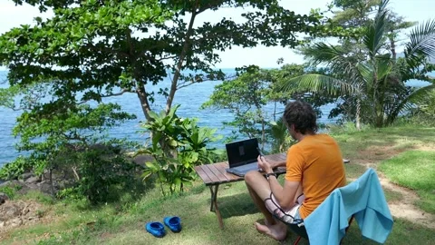 Ideal workplace for a freelancer , camping life, man working on a laptop Stock Footage 293273582