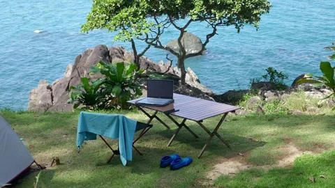 Ideal workplace for a freelancer in nature with a view of the sea Stock Footage 293273583