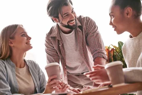 Ideas are easy. Implementation is hard. Startup business people having lunch at Stock Photos