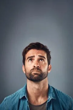 Ideas, thinking and man with decision, confused and problem solving on grey Stock Photos