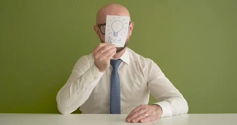 Ideea  - A man presents a note with the word Stock Footage 267089520