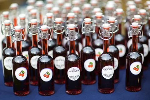 Identical bottles with a drink on the table Stock Photos
