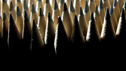 Identical graphite pencils in rotation.  Black background for text Stock Footage 76159165