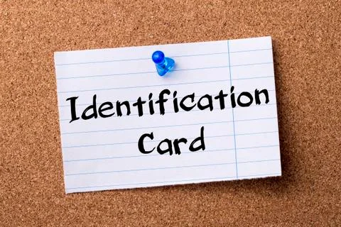 Identification Card - teared note paper pinned on bulletin board Stock Photos