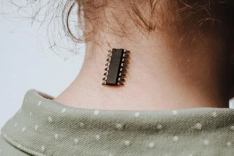 Identification chip and data implanted in a girl Stock Photos