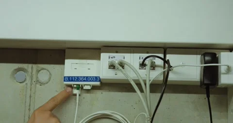 Identifying Fiber Optic Wall Outlet by Connection Number Stock Footage 337140387