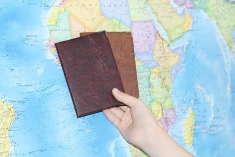 Identity document on the background of a geographical map. Stock Photos