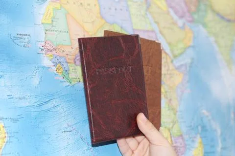 Identity document on the background of a geographical map. Stock Photos