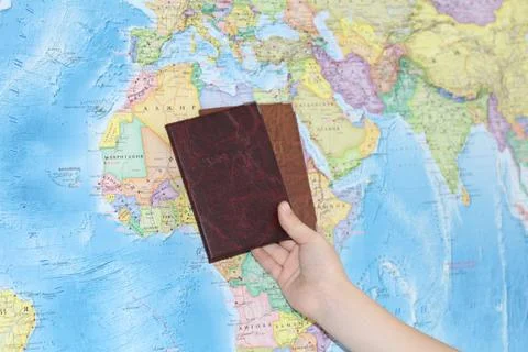 Identity document on the background of a geographical map. Stock Photos