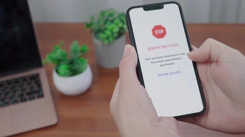 Identity Theft Alert Stop Message on AI Security App Stock Footage 341396896