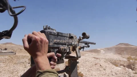 IDF soldier shooting a MAG machine gun from a tank 스톡 동영상 168537491