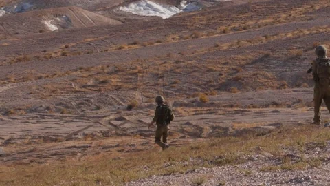 IDF soldiers walking back to their ADF after a live fire training Stock Footage 168536840
