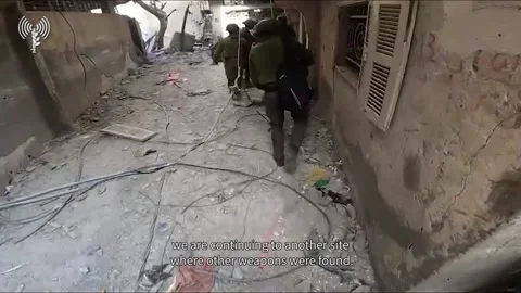 IDF Unearths Hidden Weapons Cache in Civilian Residence in Gaza Operation 스톡 동영상 259830515