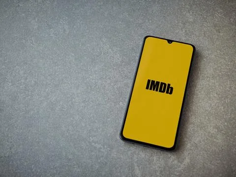 IDMb app launch screen on smartphone on ceramic stone background Stock Photos