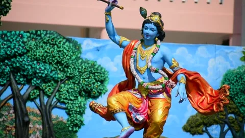 Idol of Krishna Dancing on a Kalia Snake in beautiful garden. Prem Mandir. Stock Footage 202274427