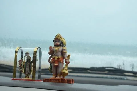 Idol of Lord Hanuman placed inside a car. Stock Photos