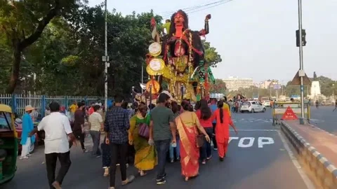 Idols  with colourful procession heading towards the  Ganges for immersion. Stock Footage 172436883