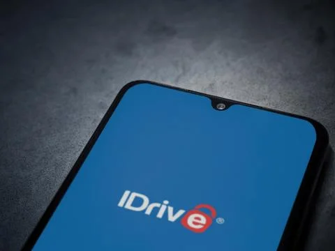 IDrive Online Backup app launch screen on smartphone on dark marble stone b.. Stock Photos