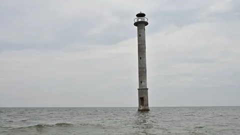 IDYLLIC. Abandoned lighthouse inside the water, sea. Stock Footage 282641878