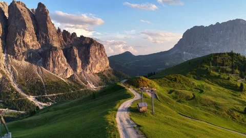 Idyllic alpine view of Gardena pass in the Dolomites at sunrise, Dolomites drone Stock Footage 313472398