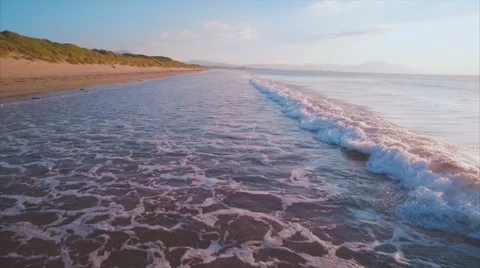 Idyllic drone footage of sea waves breaking Stock Footage 59041359
