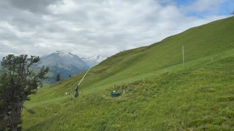 Idyllic Green Mountain Slope with Alpine Meadow and Distant Peaks in Koenig.. Stock Footage 338170774