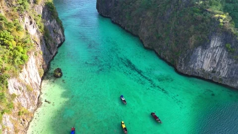 Idyllic holiday in Thailand, Phi Phi island, Maya bay with longtail boats Stock Footage 232989861