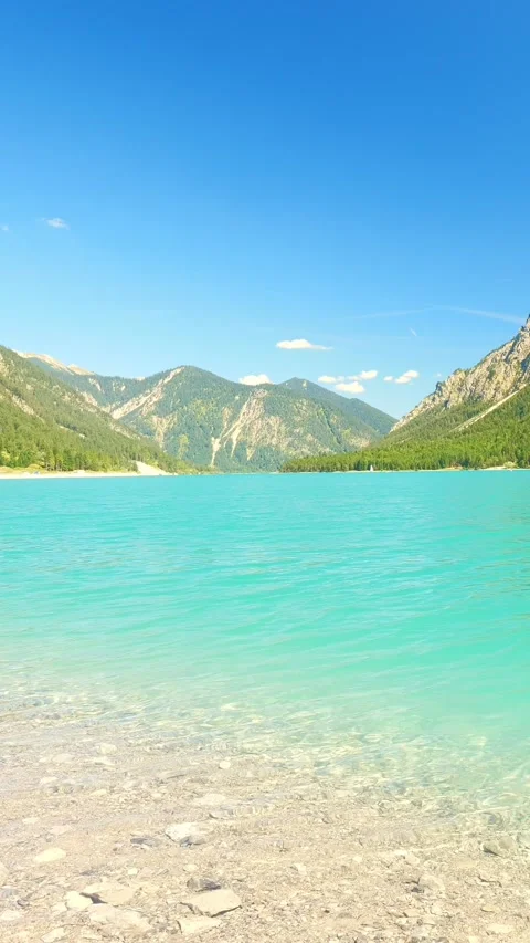 Idyllic Lakeside Views and Pristine Beaches at Plansee in Austria  Alpine Par Stock Footage 308877985