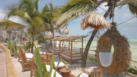 Idyllic luxury lounge setting overlooking the sea on tropical island Stock Footage 148530108