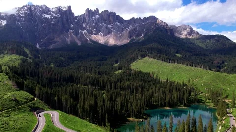 Idyllic mountain lake Carezza surrounded by Dolomites Alps, Italy. aerial video Stock Footage 274257289