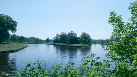 Idyllic river landscape with a small wooded island Stock Footage 336903064