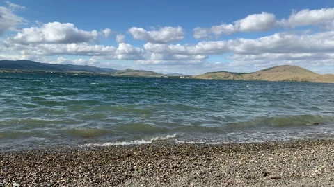 An idyllic summer landscape with a clear mountain lake and blue sky Stock-Footage 133832382