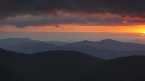 Idyllic sunset over the mountain ranges and forest Stock Footage 103826944